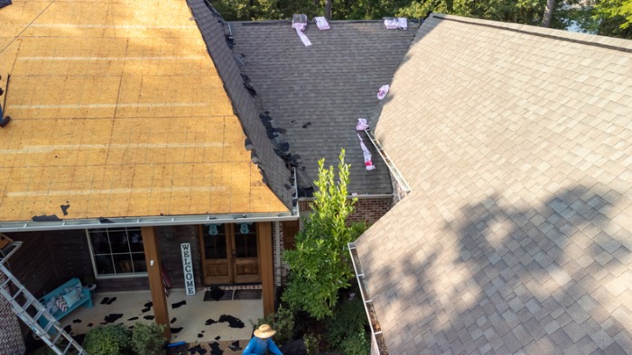 House with a new roof being installed in Portland.