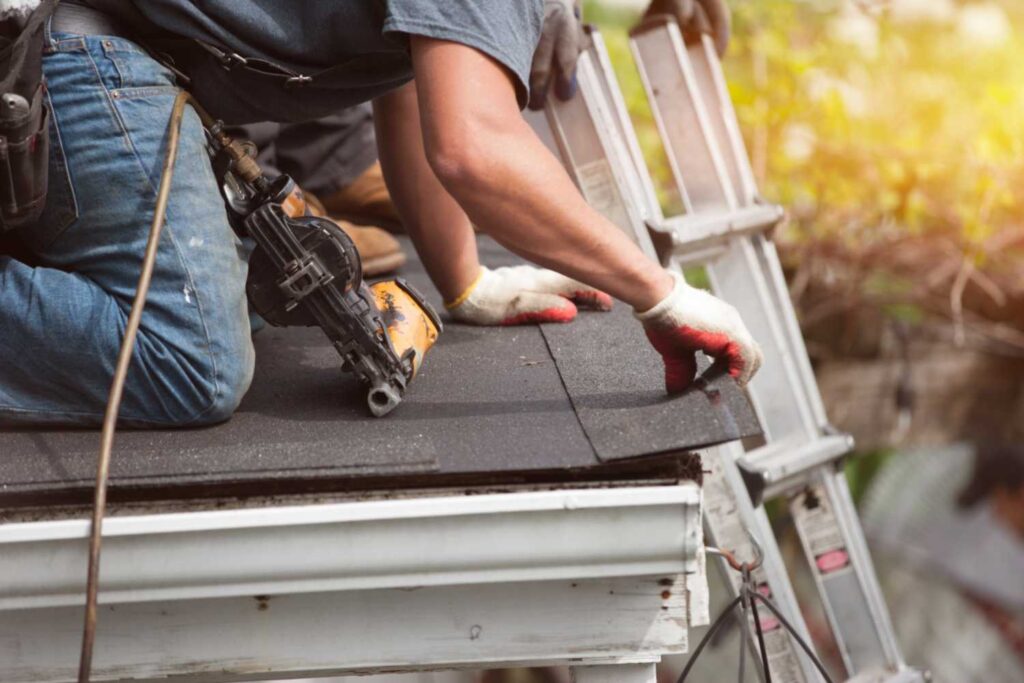 Roofers installing new cedar shingle roof on house in Portland, OR