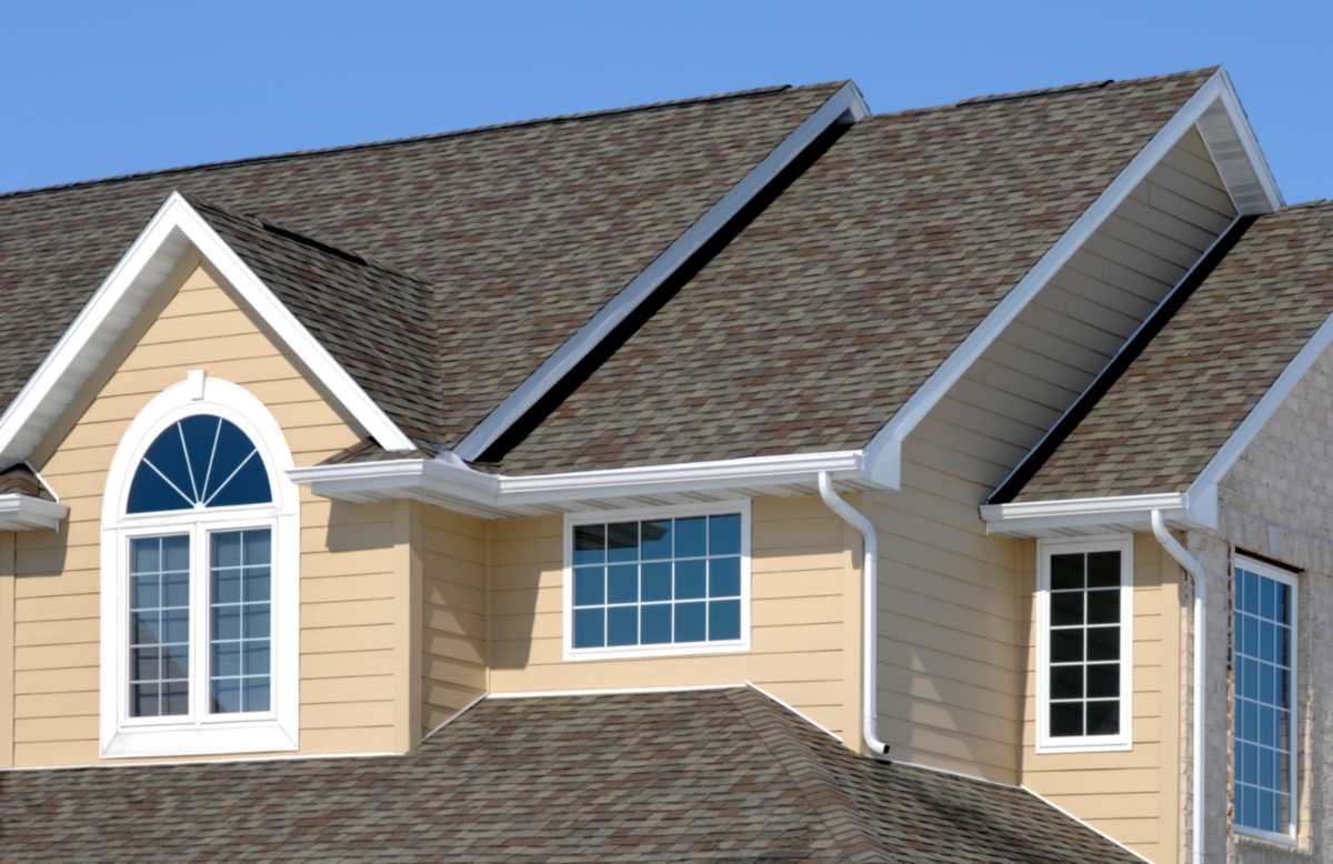 Newly installed architectural shingles with a textured design for enhanced durability & aesthetics